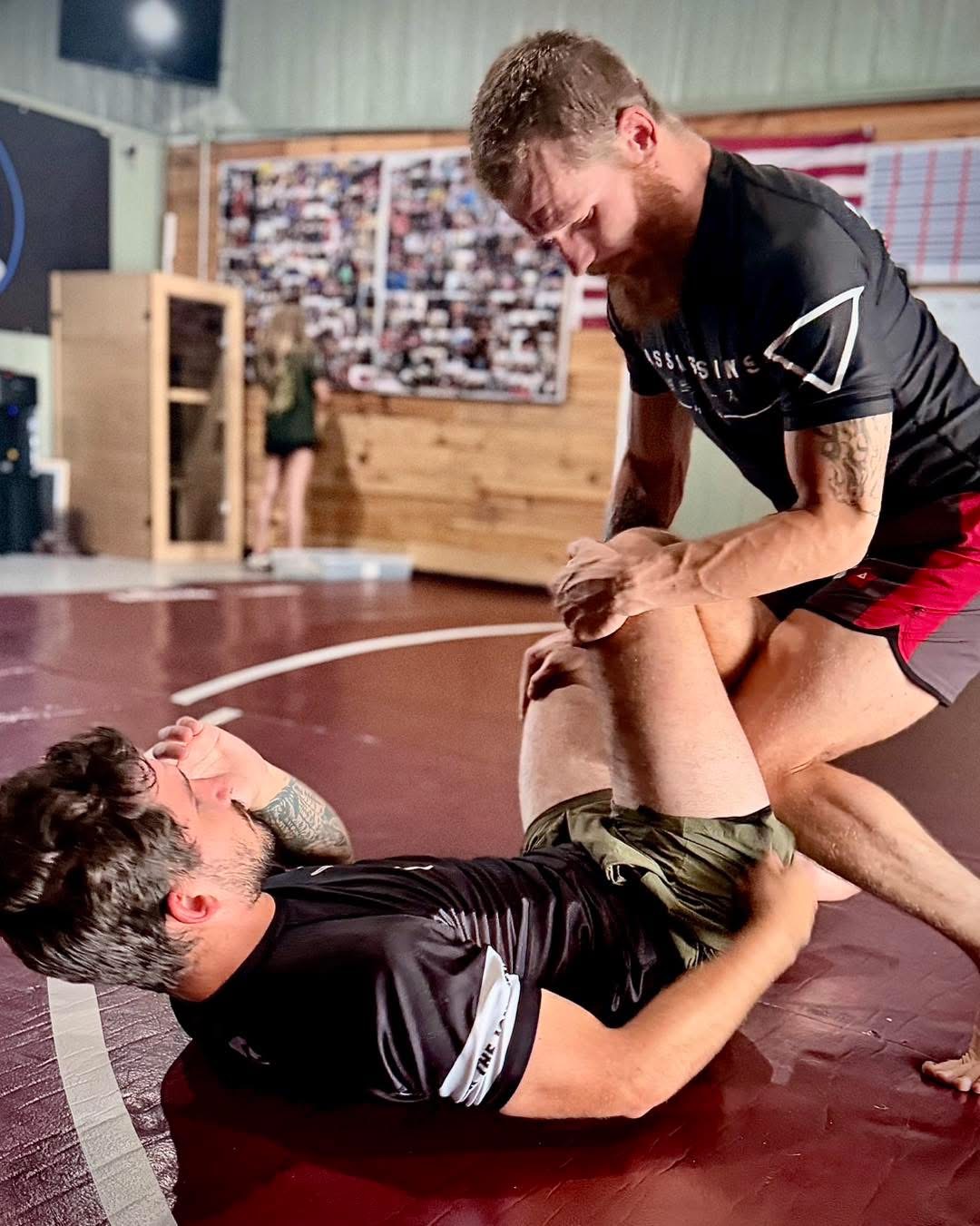 Adults training live Jiu-Jitsu rounds at Force