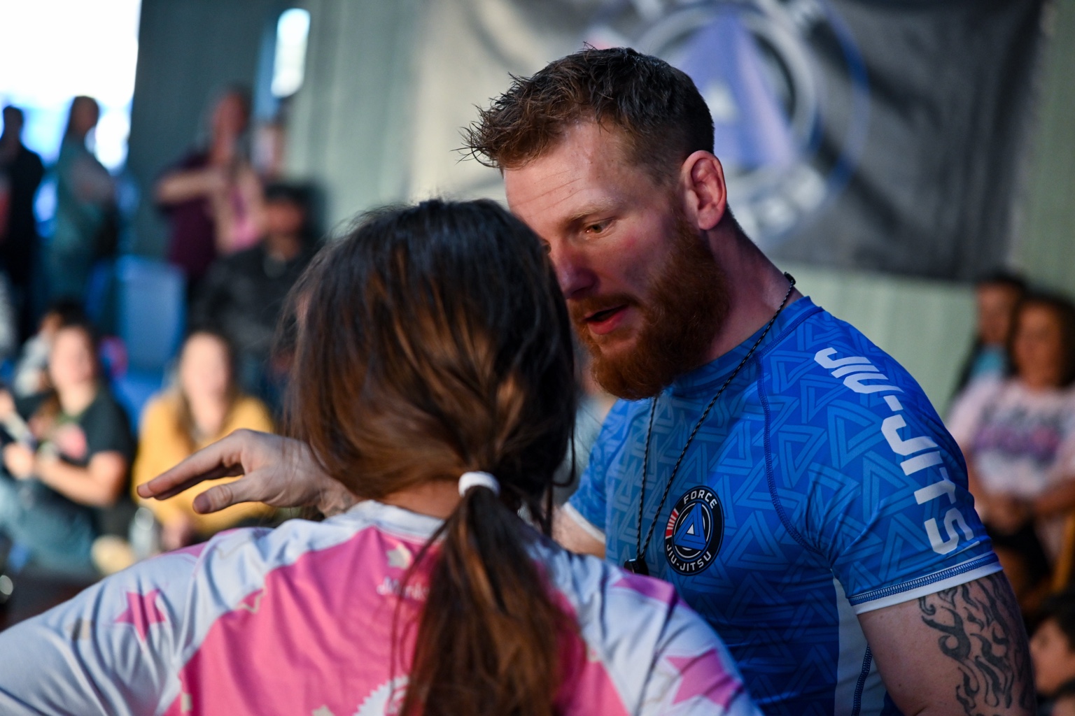 Coach Wyatt Montgomery coaching Priscilla at Force Jiu-Jitsu