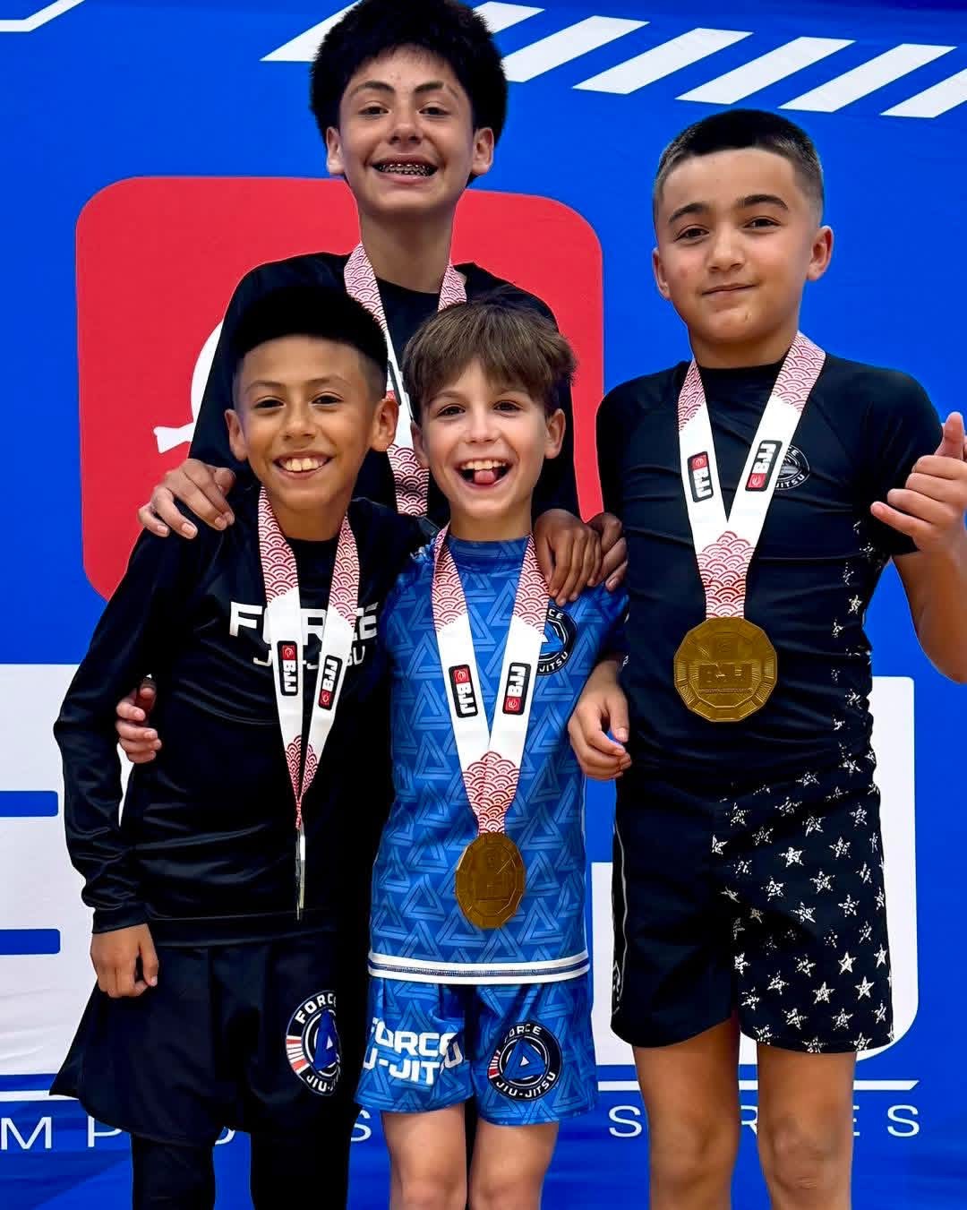 Force youth competitors celebrating with medals