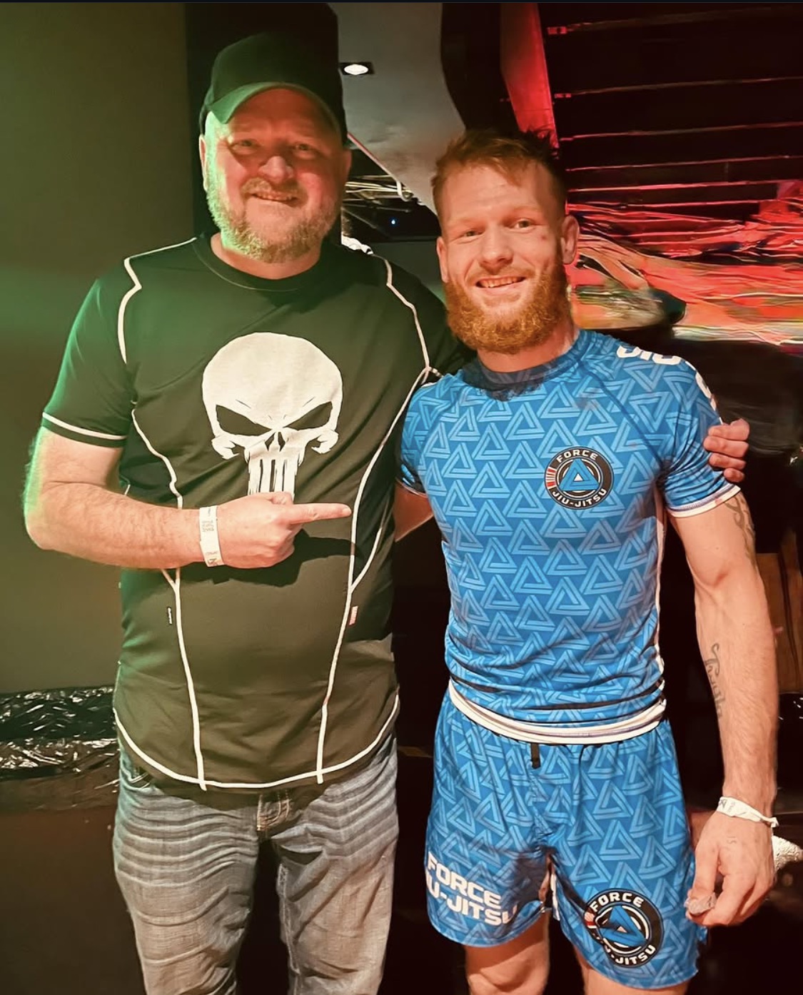 Coach Frank Mullis and Wyatt Montgomery wearing a blue Force Jiu-Jitsu rashguard
